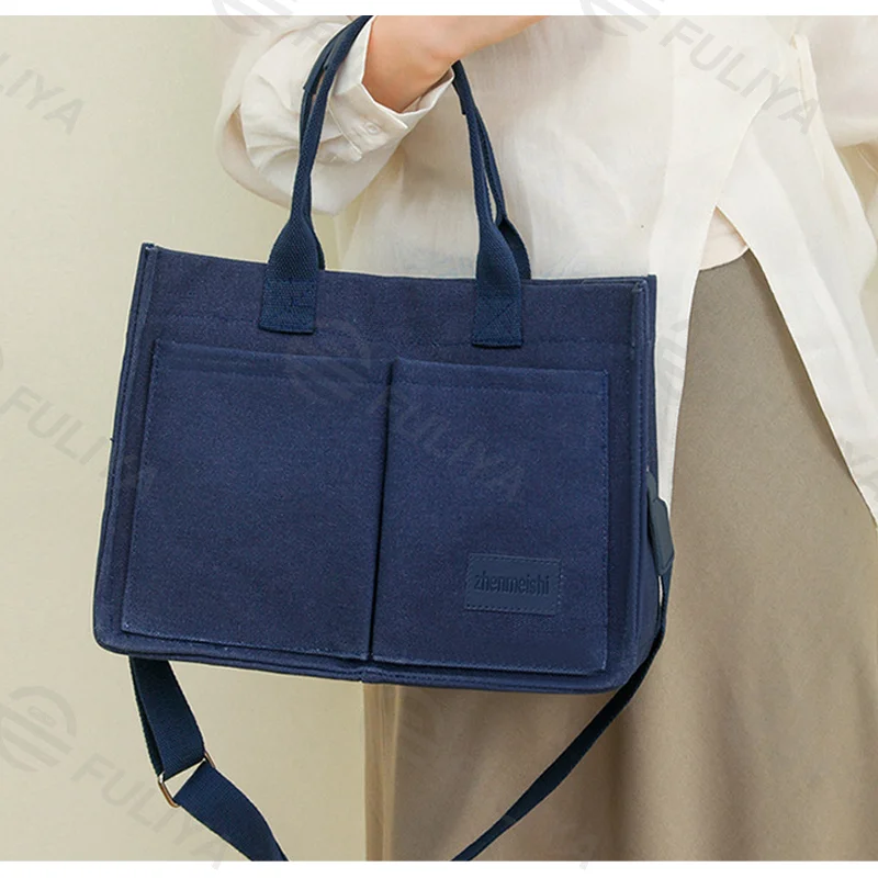 Guangzhou Fuliya Industry Co.,Ltd C-81020 Women's canvas tote bag, water-resistant, large capacity, fits 15.3" laptop, bottle, umbrella, and books, multi-layer pockets, comfortable handle, and detachable strap - for commuting, work, and travel.
