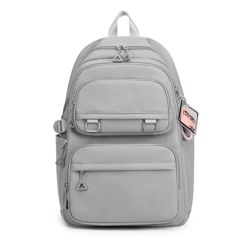 Guangzhou Fuliya Industry Co.,Ltd C-81050 Student load-reducing backpack, lightweight nylon, large capacity, front/side pockets, adjustable strap, spine-protecting back pad, and luggage strap - for primary and middle school students.